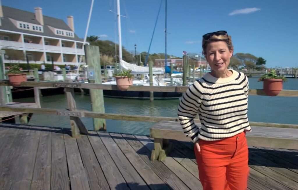 Samantha Brown on the boardwalk in front of the Inlet Inn in Beaufort, NC
